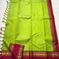 Maavilai Arakku Chakram — Korvai Kanchipuram Pure Silk

Parrot-green vaira-oosi body with soft pin-stripe sheen

Contrast arakku/rani border with gold chakram medallions & temple motifs

Arakku pallu with all-over coin-jaal; contrast blouse included