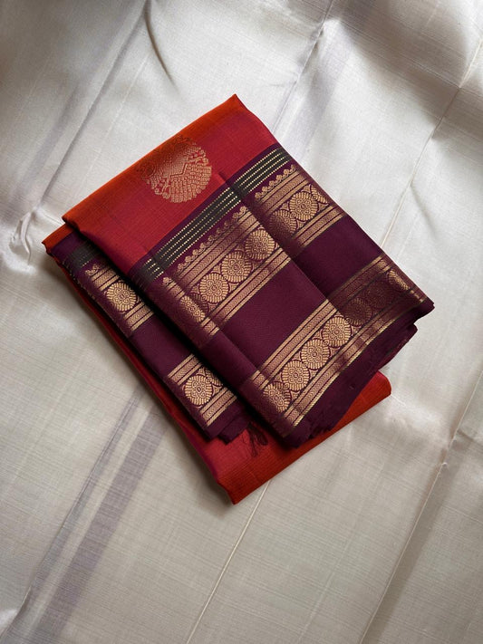 Ishwaryam 🧡❤️🕊️✨
Orange Red Shot Handwoven Kanchipuram Silk Saree with Majestic Gandaberunda Zari Adai Motif 🕊️🌟
Ornate Rettapet Border with Delicate Kamalam Seer Floral Detailing 🌺🪡
Deep Coffee Brown Pallu Adding Warmth and Elegant Contrast ☕🌿