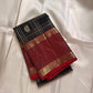 Kanmani Karuppu Kattam Ruby – Pure Kanchipuram Silk Saree
Deep black body with gold kattam checks & peacock buttas
Contrast ruby-red korvai borders
Grand ruby-red pallu with floral & lattice zari motifs
Silk Mark Certified | ships in 2 weeks