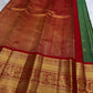 Copper-gold pallu close-up with dense micro-zari field.