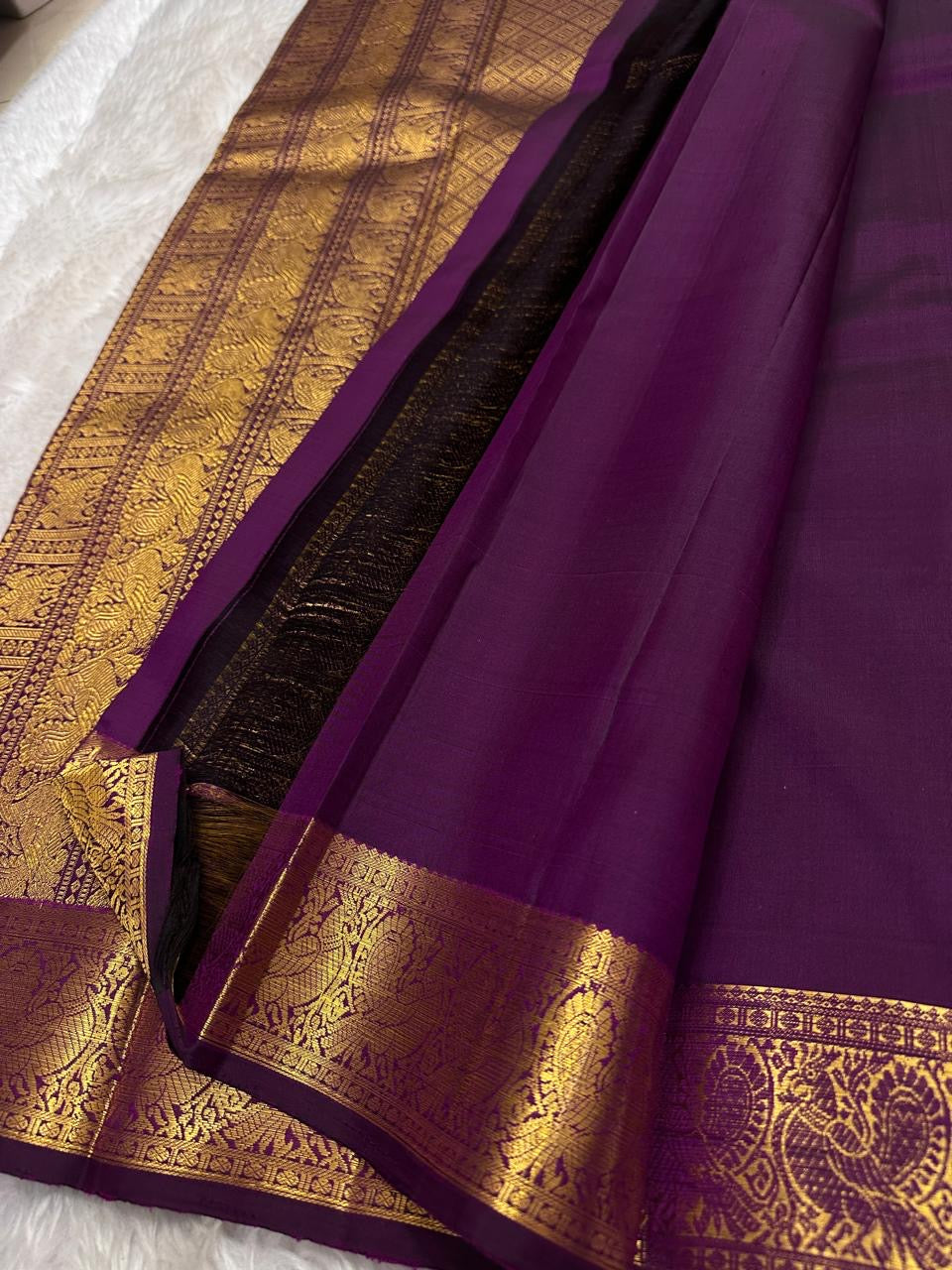 Traditional Kanchipuram silk saree in jewel-toned orchid purple with heritage Annapakshi weaving