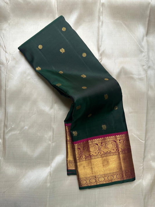 Deep forest green Mayil Butta pure Kanchipuram silk saree with deep pink zari border