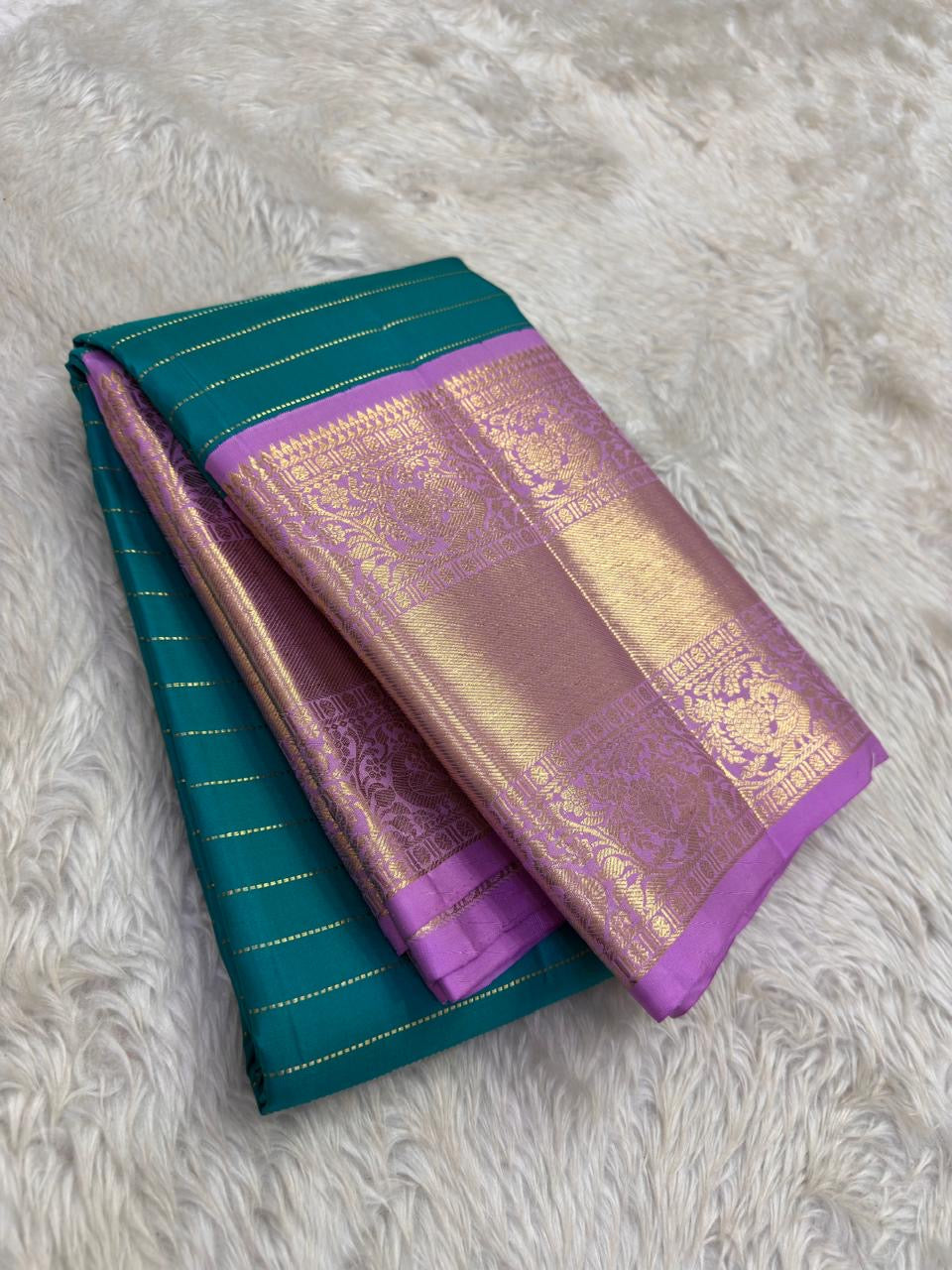 Peacock Teal pure silk Kancheepuram saree, Korvai weave with Royal Purple Zari border — folded view