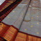 Taupe Glow – Pure Kanchipuram Silk Saree
Ash Taupe Grey Body with Lilac Undertone
Intricate Devadatta Flying Horse Motif in Zari
Deep Maroon Varisaipet Border with Rich Contrast
Grand Zari Pallu with Thazampoo Temple Motifs