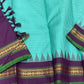 Gopura Neelam — Kanchipuram Pure Silk Saree

 

 

Teal-green body with micro kattam checks for a sleek drape

Regal aubergine korvai border with gopuram/temple motifs & gold zari

Parrot-green selvedge for a fresh, festive pop of contrast

Aubergine pall