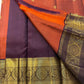 Rust Orange Supreme – Korvai Kanchipuram Pure Silk Saree
Shot rust-orange body with gold chakram & mankolam buttas all over
Deep purple korvai border with annam & chakram zari medallions
Rich vadamalli zari-brocade pallu | Contrast blouse | Fall & Pico Do
