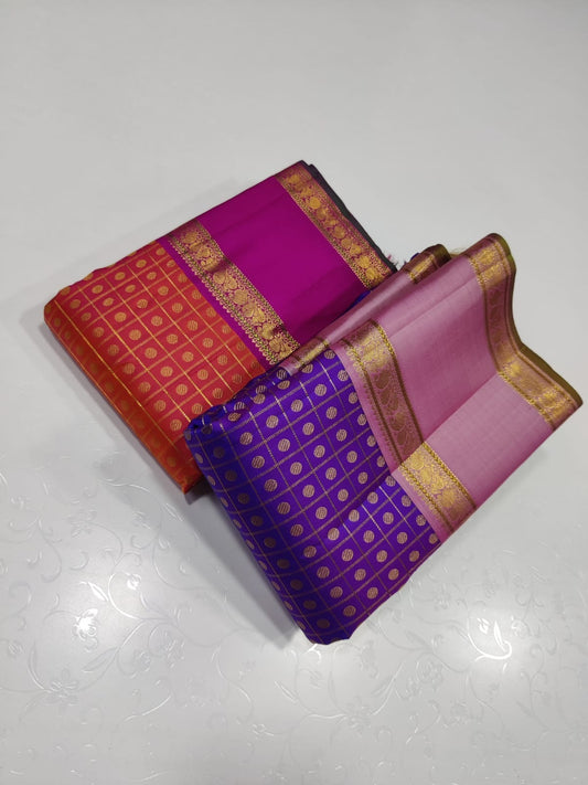 Violet Bloom – Pure Kanchipuram Silk Saree
Royal purple body in fine kattam checks with oval buttas ✨
Rose-pink korvai borders in ornate 2g zari

Silk Mark Certified, delivery in 2 weeks