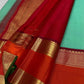 Poomugam Pachai
Pure Silk in Tender Mint & Kumkum Red
Zari-Woven Grandeur in korvai  Contrast