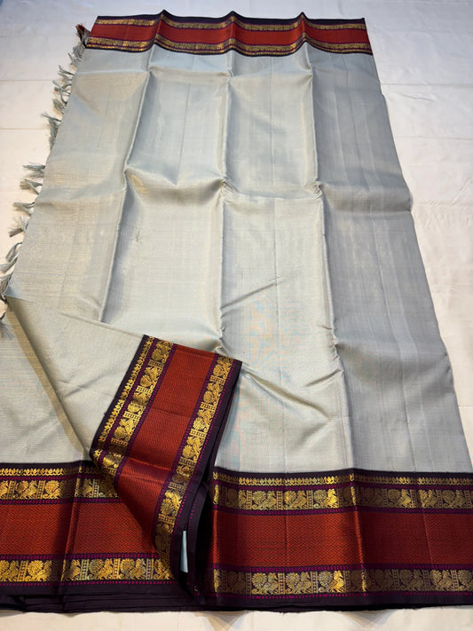 Dove Arakku Vairaoosi — Pure Kanchipuram Silk Saree
Dove Grey Body with Arakku Red Zari-Woven Vairaoosi Pattern
Silk Mark Certified • Free Shipping within USA • Ships in Two Weeks