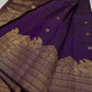 Swarna
Majestic Purple Pure Silk Kanchipuram Saree with Broad Varisaipet Zari Border,Intricately Woven Peacock and Elephant Motifs alongside border . Peacock motifs all over.