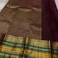 Kaamini ✨ — Purple Pure Kanchipuram Silk Saree
With Elegant Brown Korvai Border & Bold Stripes
Adorned with Scattered Gold Zari Buttas on Body
Intricate Zari Weaving in Regal Brown Pallu
Contrast Blouse with Matching Korvai Border