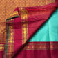 Neer Pachai Vairaoosi — Kanchipuram Pure Silk saree 

Sea-foam/aqua body with classic Vairaoosi pinstripes

Contrast ruby-maroon korvai borders with gold chakram & floral panels

Grand maroon pallu with all-over chakram jaal and paisley vines; aqua tassel
