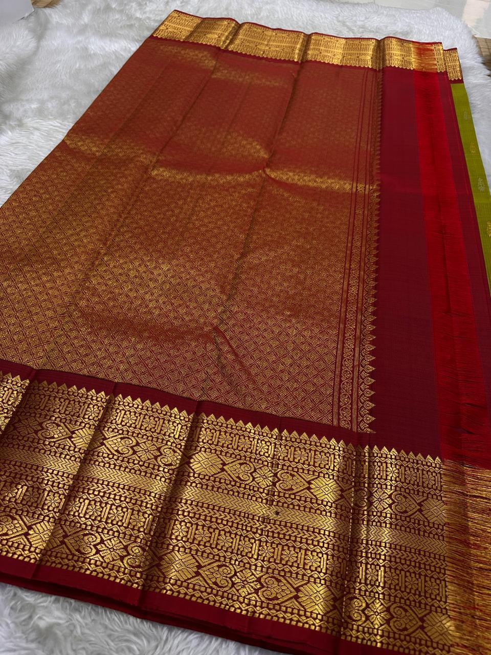 Golden Emerald Gleam ✨ – Pure Kanchipuram Silk Saree
Parrot Green & Turmeric Shot with Gold & Silver Leaf Buttas 🌿
Crimson Red Korvai Border with Temple Peaks  ❤️
Grand Crimson Pallu 🌟

Silk Mark Certified, delivery in 2 weeks