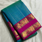 Kavi ✨ – Pure Kanchipuram Silk Saree
Teal Blue Silk Body with Lustrous Shot Weave
Rich Magenta Contrast Border in Gold Zari
Grand Pallu with Intricate Kili (Parrot) Motifs
Magenta Blouse with Matching Zari Border Silk Mark Certified, delivery in 2 weeks
