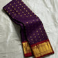 Sindhu – Royal Purple Kanchipuram Pure Silk Saree with Gold Zari Floral Buttas, Crimson Rettapet Border & Ornate Pallu