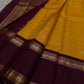 Bhanu – Mustard Gold Handwoven Kanchipuram Silk Saree with Deep Coffee Brown Borders, Intricate Elephant Motif Zari, and a Grand Temple-Inspired Pallu