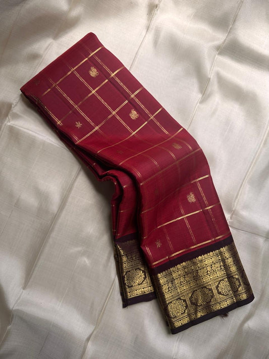 Arakku  maroon Zari kattam pure silk Kanchipuram with Zari motifs and varisaipet border and ornate palla