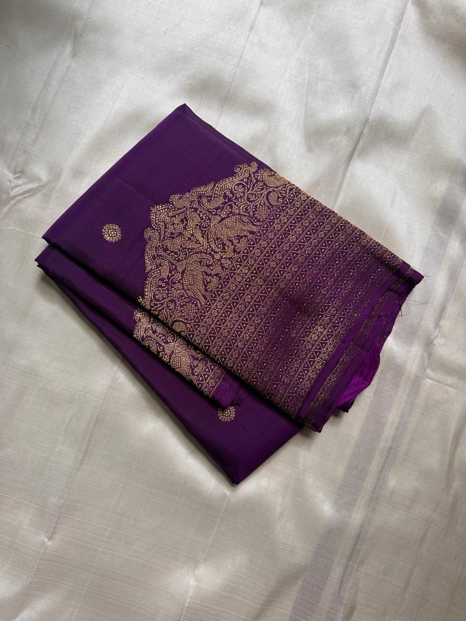 Lotus Glow — Violet | Pure Kanchipuram Silk Saree
A royal violet canvas with antique-gold zari peacocks, elephants & lotus motifs ✨
Silk Mark Certified • Free USA Shipping • Ships in Two Weeks
