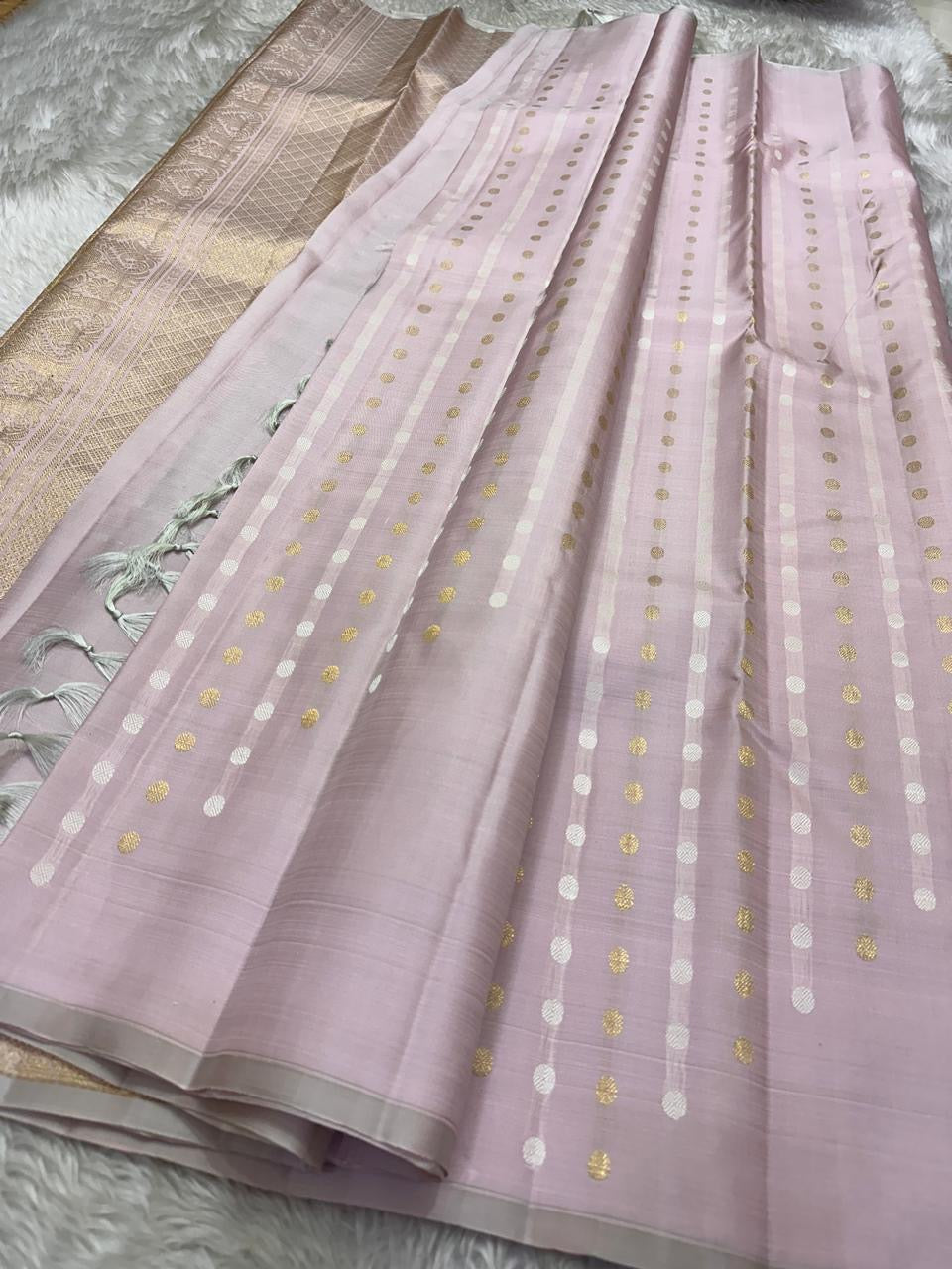 The daintiest blush pink with zari coin buttas in gold and silver pure silk Kanchipuram saree