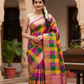 Pallavi – Kanchipuram Paalum pazhamum checks/ Zari kattam  Silk Saree in Turmeric, Mango, Leaf Green & Beetroot Pink Checks.
Finished with a vibrant magenta border and rich gold zari pallu.