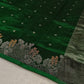 close up of green chanderi silk saree body with scattered woven motifs and border