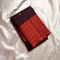 Minmini – Deep brown Pure Kanchipuram Silk Saree with Gold Zari Buttas, Vibrant Orange Checked Border in Zari Kattam Weave & Ornate Gold Brocade Pallu with Traditional Motifs