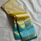 Body: pastel lemon-cream with tiny gold zari buttas

Borders/Pallu: sea-foam aqua with temple (reku) peaks & paisley vine zari

Silk Mark Certified • Free USA Shipping • Ships in Two Weeks
