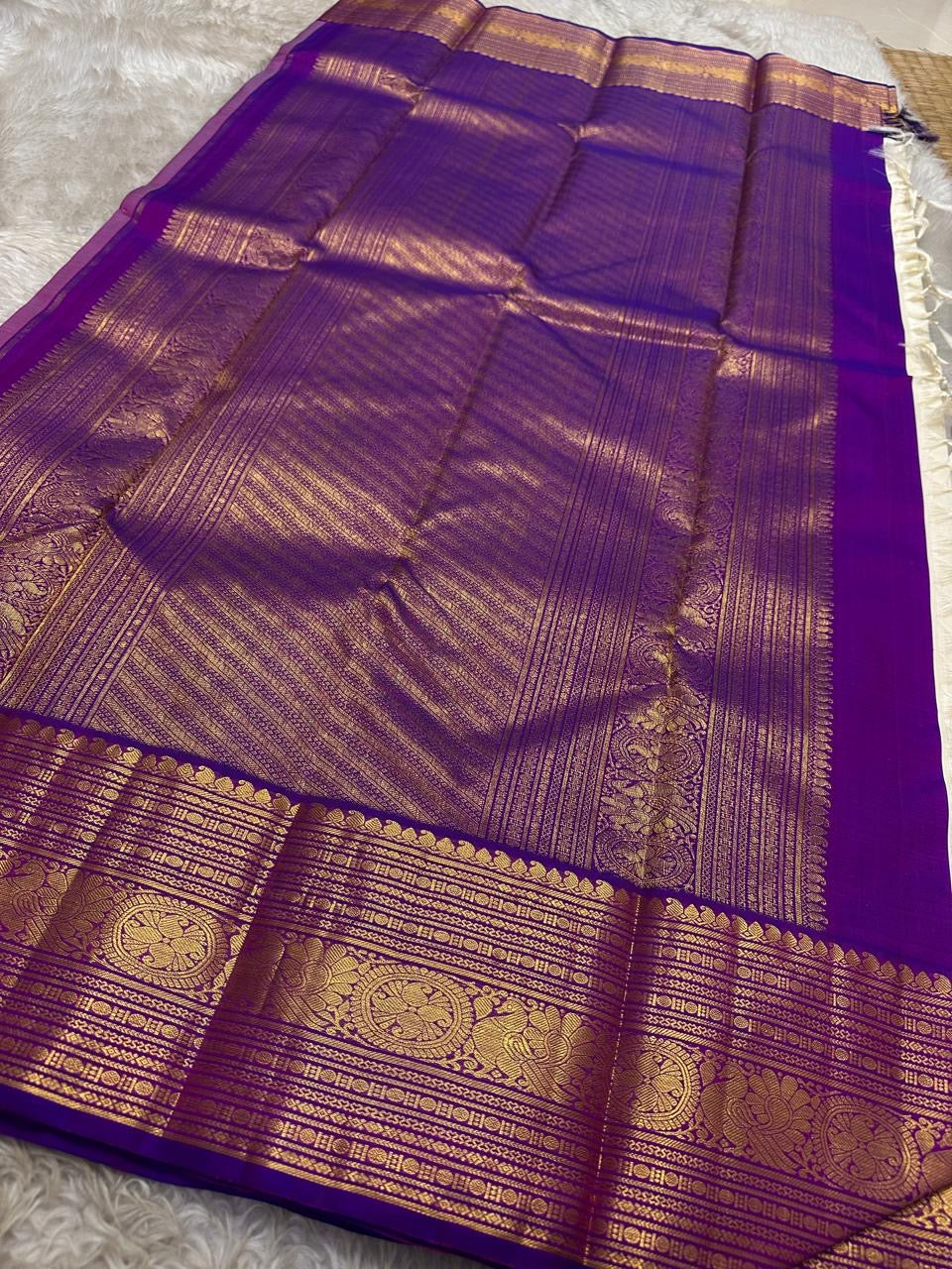 Hamsa Paisley — Pure Handloom Kanchipuram Silk Saree 
Ivory Body with Gold Paisley Buttas & Royal Purple Brocade Border ✨
Silk Mark Certified • free shipping within Usa ships in two weeks