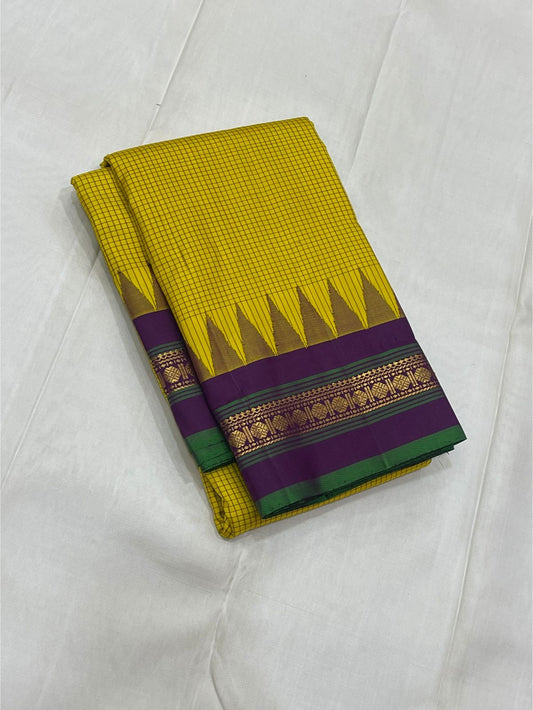Ochre Turmeric Kattam

Pure Kanchipuram Silk Saree – Ochre Yellow Body with Fine Kattam Checks

Contrast Korvai Borders with Temple Serrations & Floral Zari

Grand Zari Brocade Pallu with Hand-Knotted Tassels

Silk Mark Certified ✅ |ships in 2 weeks
