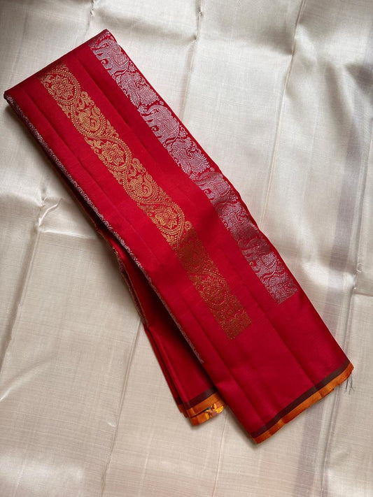 Lavanya– Vermillion Red Handwoven Kanchipuram Silk Saree in red with Gold & Silver Zari, this deep red Kanchipuram silk saree with intricate motifs in gold and silver zari, including Gandaberunda, parrots, elephants &lotuses as seen on Nita Ambani