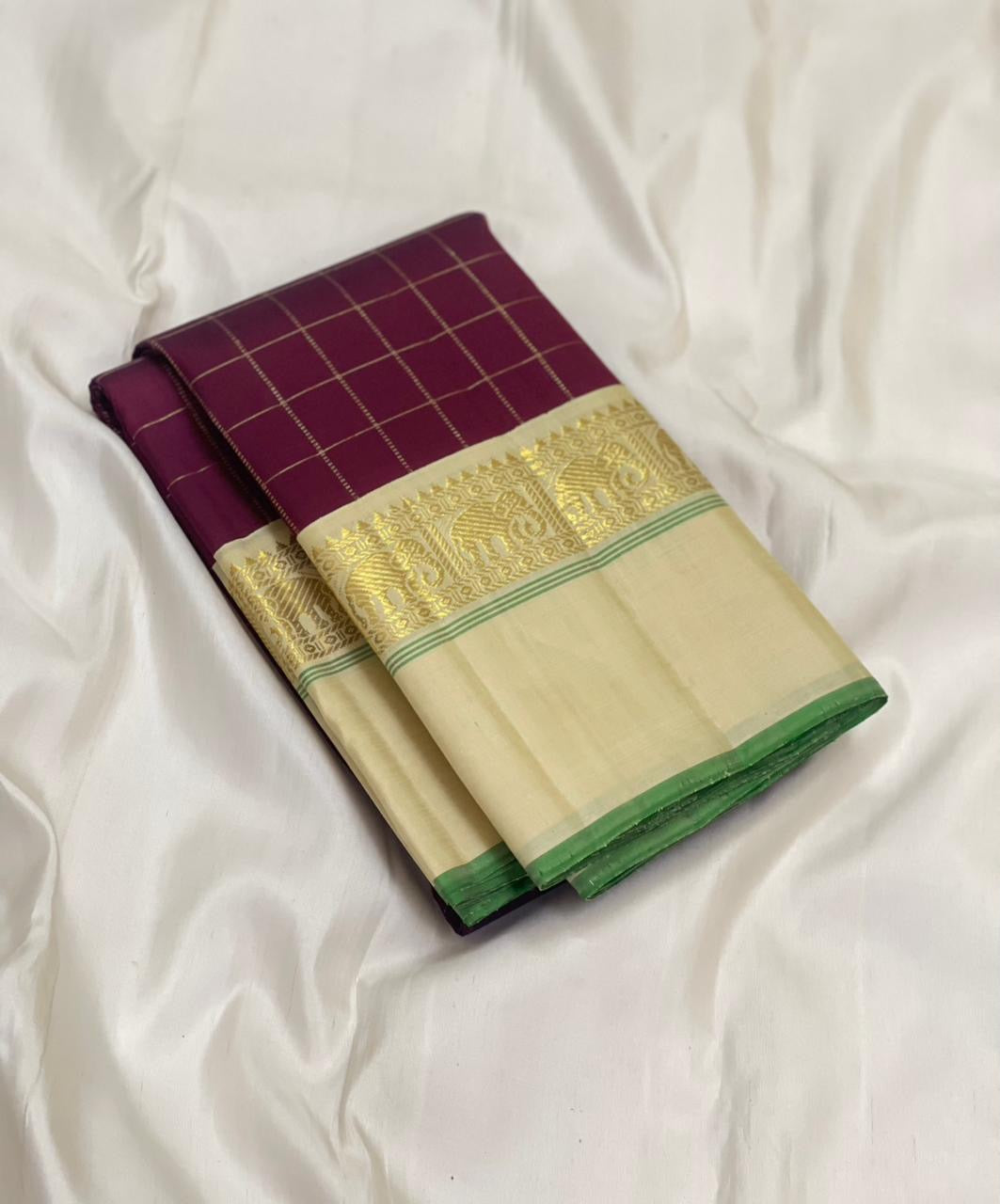 Kanchana Checks — Pure Kanchipuram Silk
Jamuni Gold Grid × Ivory border  with Gaja Zari
Ivory Zari Pallu • Contrast Jamuni Blouse
Silk Mark Certified • Free Shipping within USA
Dispatch in 1 Week • Ships in Two Weeks