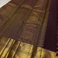 Open view of Gandaberunda zari kattam Kanchipuram silk saree, plum body with grid checks and gold buttas, finished with grand elephant zari border.