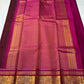 Arakku Kattam Mayura Chakram – Pure Silk Kanchipuram Saree (Maroon & Rani Pink)

Micro-check body with tiny gold buttas; vibrant rani contrast

Antique-gold peacock chakram border & grand woven zari pallu

Silk Mark Certified | Blouse Piece Included |