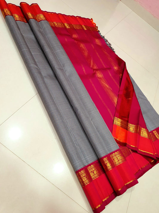 Rani Ember Podi Kattam – Pure Kanchipuram Silk Saree
Micro Black & Ivory Checks with Korvai Rani Magenta Border
Gold Zari Coin & Floral Vine Detailing with Vermilion Selvedge
Rich Rani Magenta Zari-Striped Pallu | 
Silk Mark , free shipping within 2 weeks