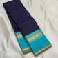 Indigo Teal Kattam – Pure Silk Kanchipuram Saree
Deep Indigo Body with zari Kattam Checks
Teal Contrast Korvai Border with maanga pet and mayil kann border, maanthulir selvedge  , silk mark certified -ships in two weeks