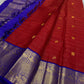 Raaga – Red and Blue Pure Kanchipuram Silk Saree with Gold Zari Border
Features a striped red body with small gold buttas and a royal blue pallu.
Finished with intricately woven peacock motifs in pure zari across the border.