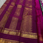 Magenta pallu spread with gold zari jaal panels and broad zari border with heritage detailing
