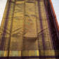 Rust Orange Kattam Rettapet – Pure Silk Kanchipuram Saree
Rust Orange Body with Petite Gold Buttas & Fine Kattam Grid
Deep Aubergine Rettapet Korvai Double-Line Contrast Border
Rich Zari Diamond & Chevron Brocade Pallu
Comes with Contrast Aubergine Blouse