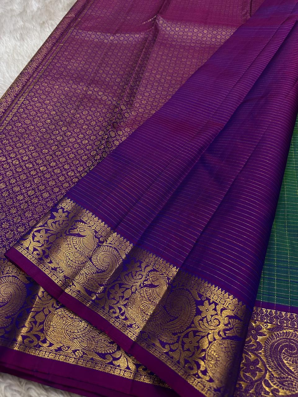 Vrindavan Meadow
Peacock Vairaoosi in Emerald & Lagoon Blue
Pure Kanchipuram Silk · Zari-Woven Border Grandeur
