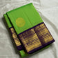 Arangetram — Parrot-Green Kanchipuram Pure Silk
Royal Purple Korvai Border 

Elephant Procession Panels & Coin Buttas

Rich Brocade Pallu • Blouse Included

Silk Mark Certified • Free USA Shipping • Ships in Two Weeks