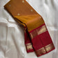 Ponvandu Kumkumam – Pure Kanchipuram Silk Saree
Honey-Gold Body with Zari Buttas
Contrasting Kumkum Red Borders with Floral Zari
Grand Kumkum Red Pallu with Zari Kaddi & Brocade
Silk Mark , | ships in 2 weeks, fall pico | Blouse Stitching Available |