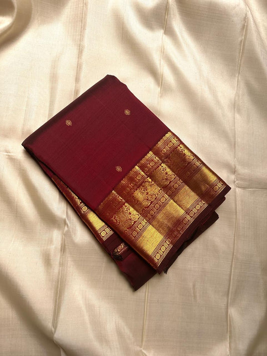 Deep brown small flower motif with vanasringaram and Rudhraksham border pure silk mark certified Kanchipuram saree