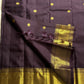 Nagavalli – A Midnight Jamun Dream in Kanchipuram Silk, Woven with Gold Coin Buttas, Temple-Inspired Arai Maadam Border, and Rudhraksham Seer in Lustrous Zari