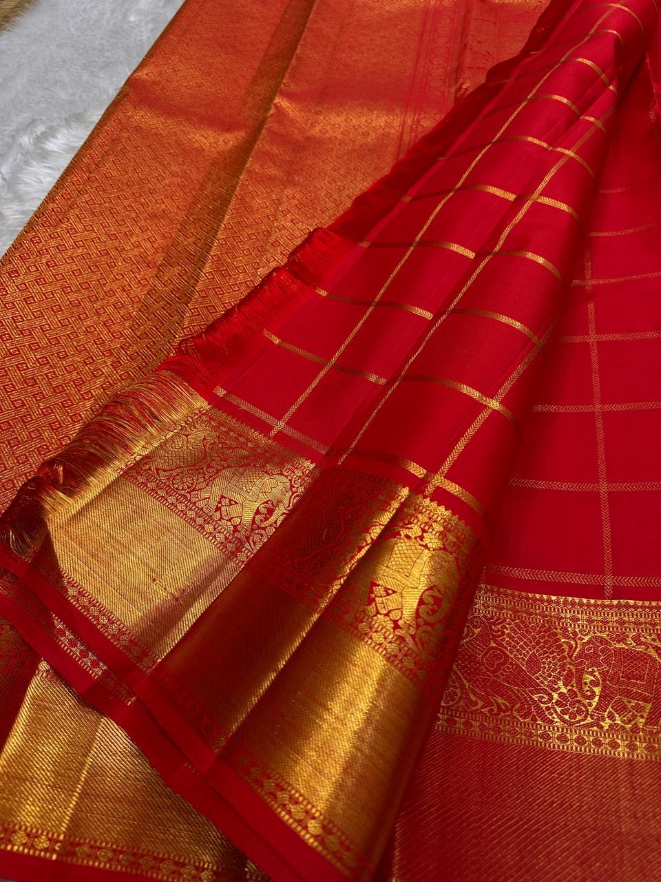 Srija – Red-Orange zari kattam  Kanchipuram Pure Silk Saree with Zari Checks, Kamalam Buttas & Vanasringaram Border
