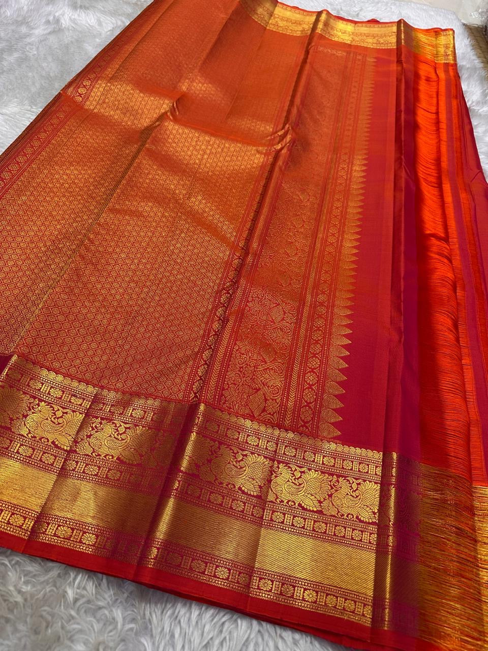Fiery orange red shot double  color small flower motif with vanasringaram and Rudhraksham border pure silk mark certified Kanchipuram saree