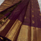 Varnika – Handwoven Kanchipuram Silk Saree in Plum Wine
A regal plum Kanchipuram silk saree adorned with gold zari paisleys and Gandaberunda motifs