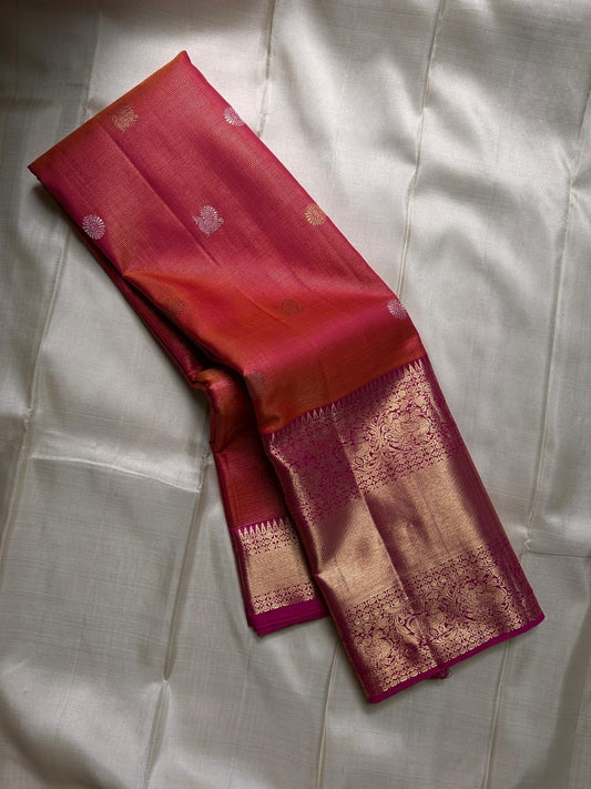 Vairaoosi -  silk Kanchipuram thanga velli ( sonaroopa) zari butta in a mesmerizing rust red  korvai getti (thick ) zari border with mayil motif