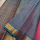 Varnam – Pastel Pink Kanchipuram Silk Saree with Sky Blue Rudraksha Border & Grid Zari Pallu | Baby Kamalam Buttas | Pure Handloom Elegance