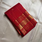 Vermilion Podi Kattam 🌺 Pure Silk Kanchipuram Saree

All-over zari pinstripes & mini podi kattam checks ✨

Broad antique-gold borders with chakram medallions 🪙

Silk Mark Certified ✅ | F