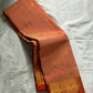 Mandara Peach – Pure Korvai Kanchipuram Silk Saree
Soft peach shot body with dainty gold chakram buttas
Vermilion-orange korvai borders with peacock medallions
Grand kumkumam red pallu with full zari brocade & temple panels
Silk Mark Certified | Free Ship